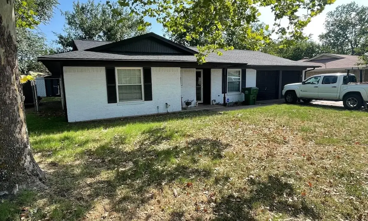Professional roofing crew working on a residential roof in Leacock